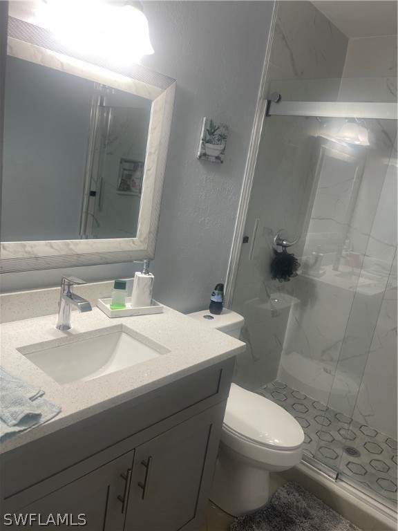 941 Happy Road North Fort Myers, FL 33903 - Photo 7 of 19 a bathroom with a sink toilet and a mirror