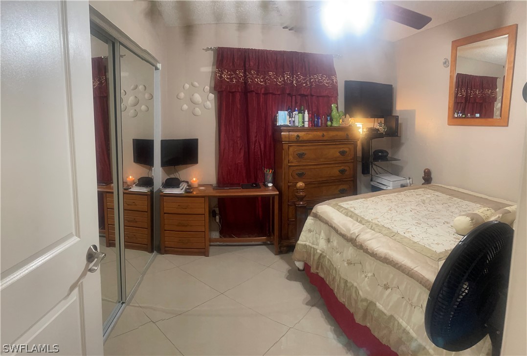 941 Happy Road North Fort Myers, FL 33903 - Photo 8 of 19 a bedroom with a bed and furniture