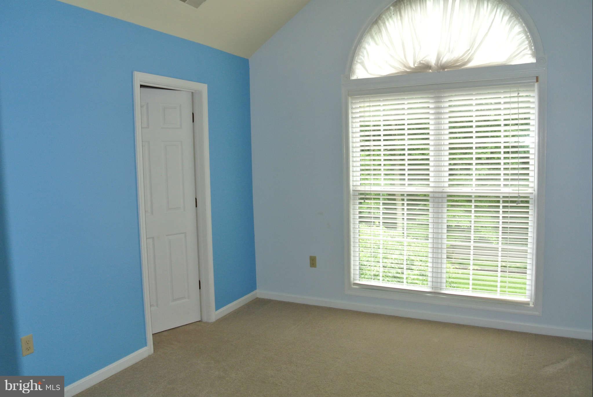 173 Cotton Ridge Road Winchester, VA 22603 - Photo 22 of 28 a view of an empty room with a window
