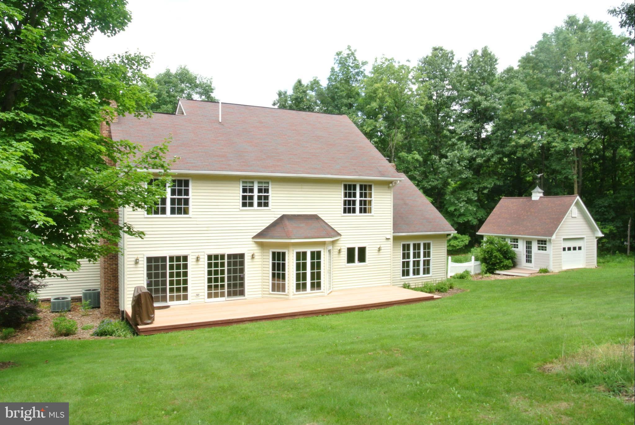 173 Cotton Ridge Road Winchester, VA 22603 - Photo 6 of 28 a front view of a house with a yard