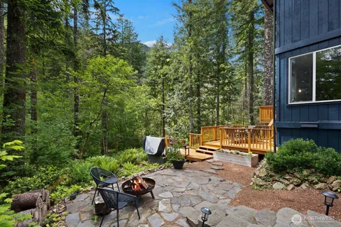 a view of a backyard with sitting area