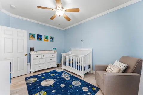 a bedroom with furniture and a window