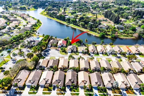 an aerial view of residential house with outdoor space and swimming pool
