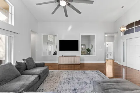a living room with furniture and a flat screen tv