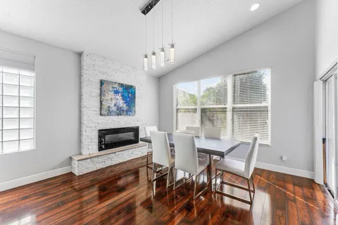 a view of a livingroom with furniture and a fireplace
