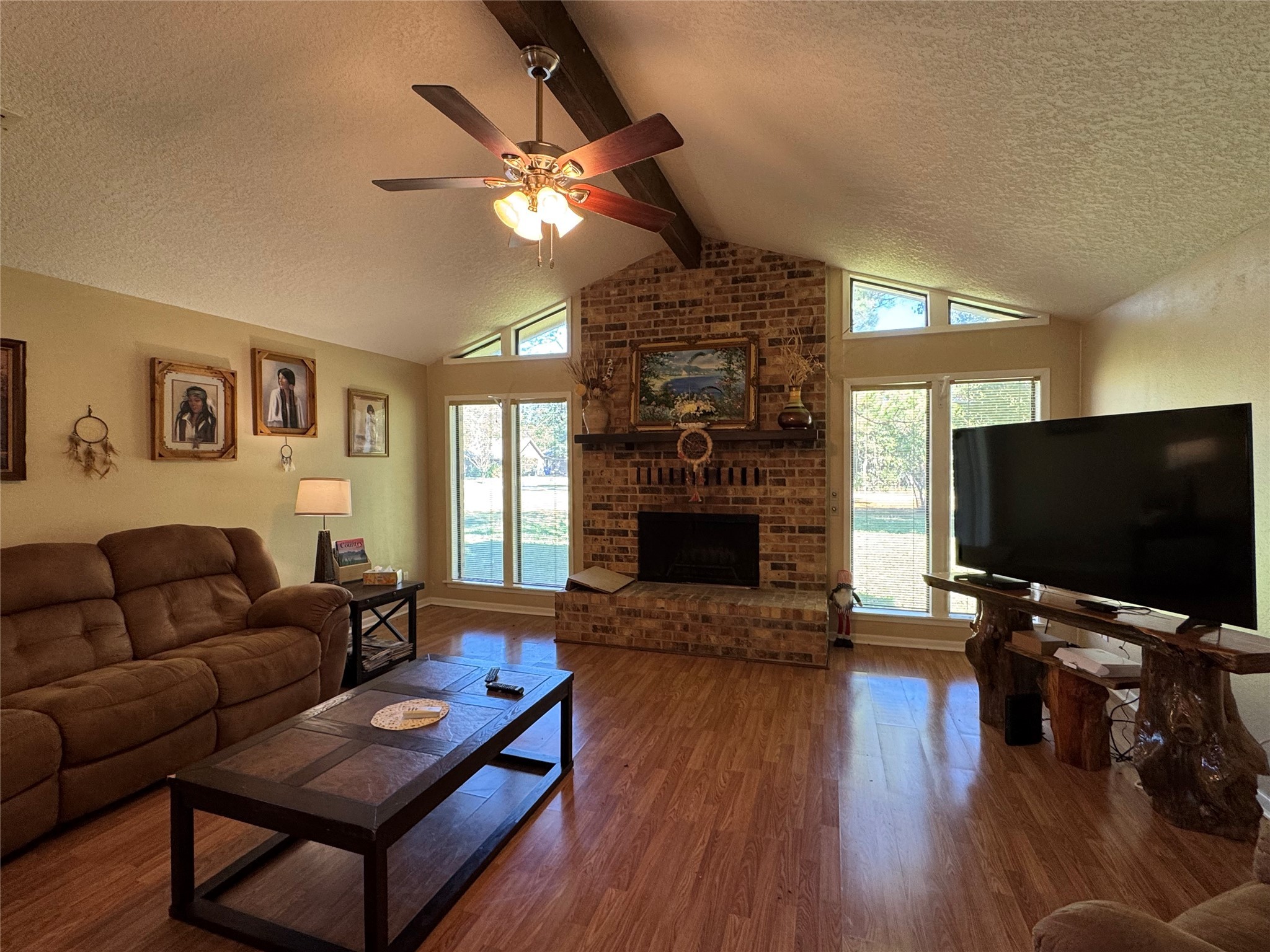 150 Schooner Drive Trinity, TX 75862 - Photo 13 of 49 a living room with furniture a flat screen tv and a fireplace