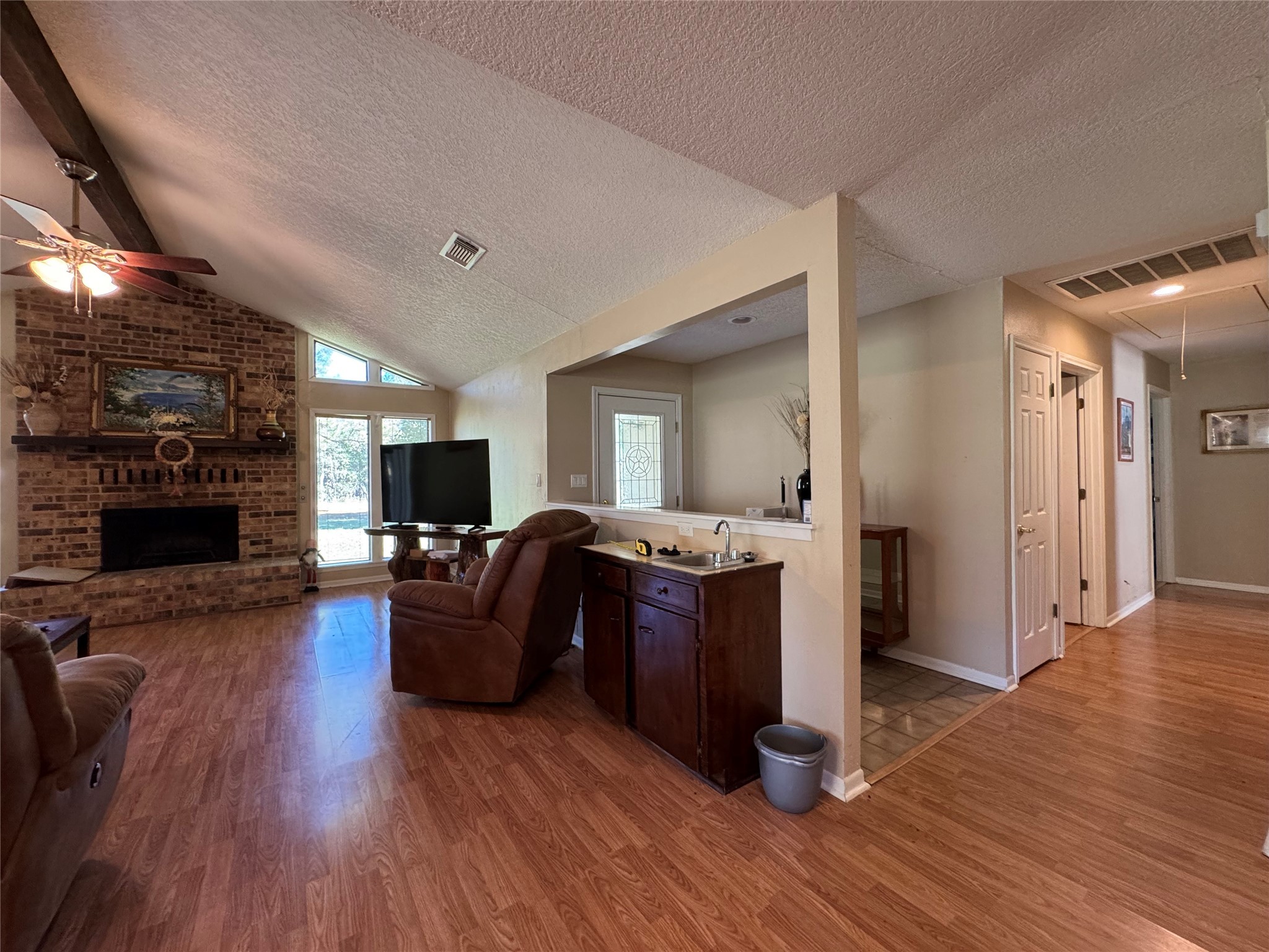 150 Schooner Drive Trinity, TX 75862 - Photo 15 of 49 a living room with furniture a fireplace and wooden floor