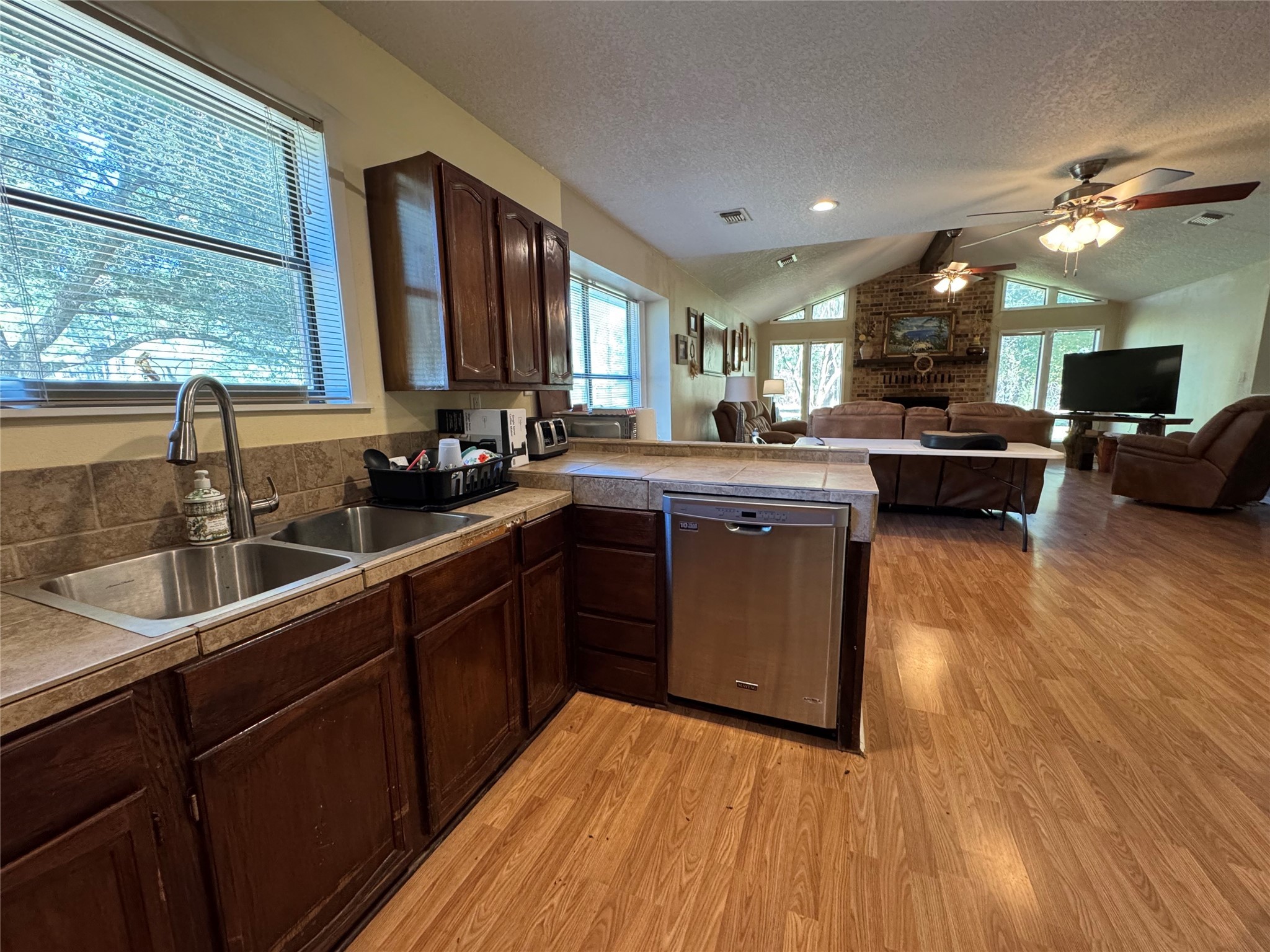 150 Schooner Drive Trinity, TX 75862 - Photo 18 of 49 a kitchen with kitchen island granite countertop a sink cabinets and wooden floor