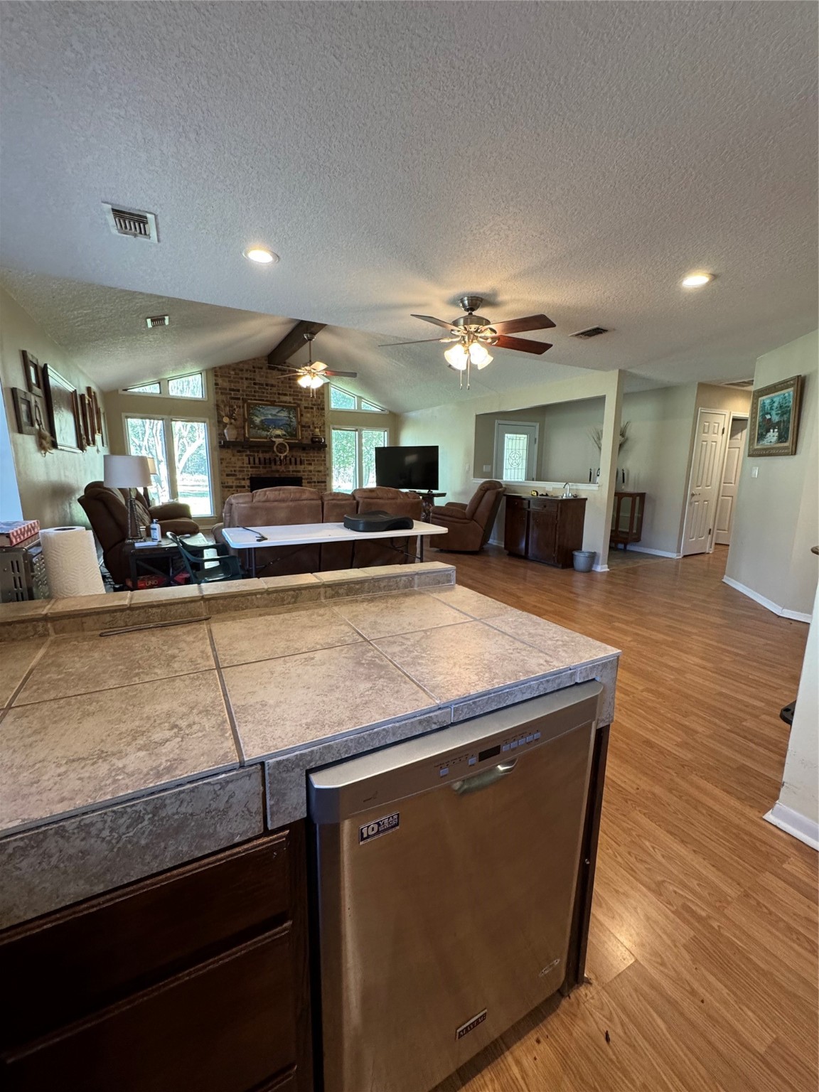 150 Schooner Drive Trinity, TX 75862 - Photo 23 of 49 a kitchen with kitchen island a counter top space a sink and cabinets