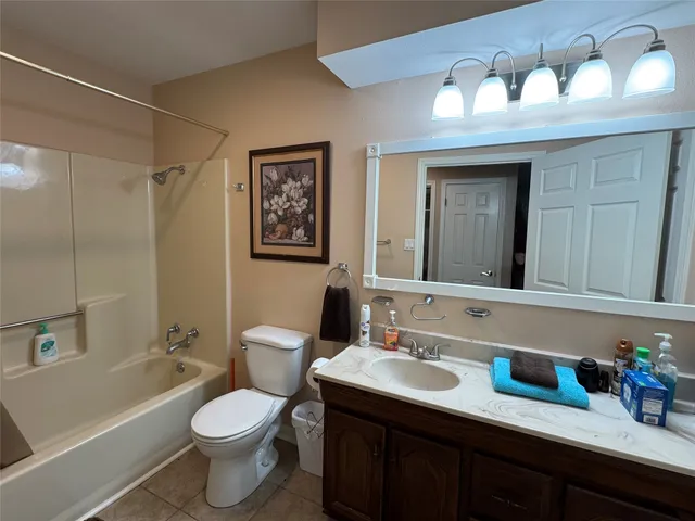 a bathroom with a toilet a sink and a bathtub