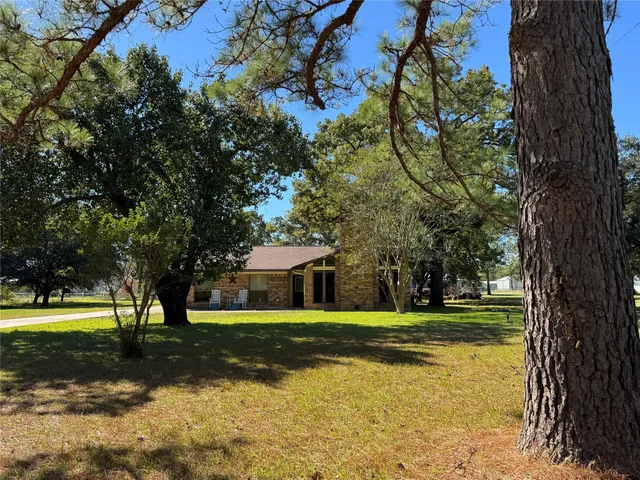 a view of a house with a big yard