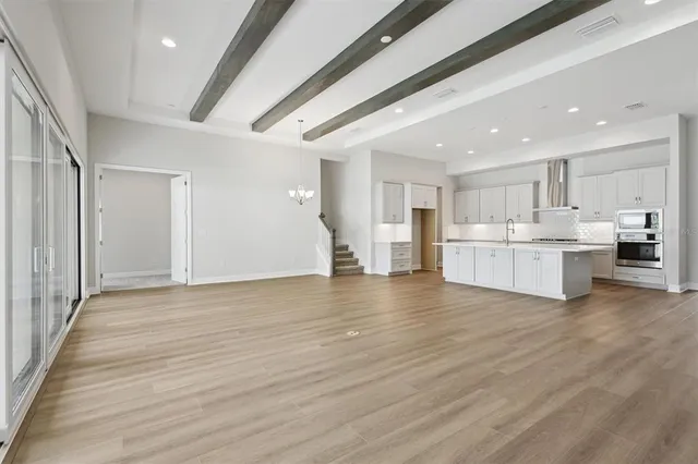a view of kitchen with wooden floor