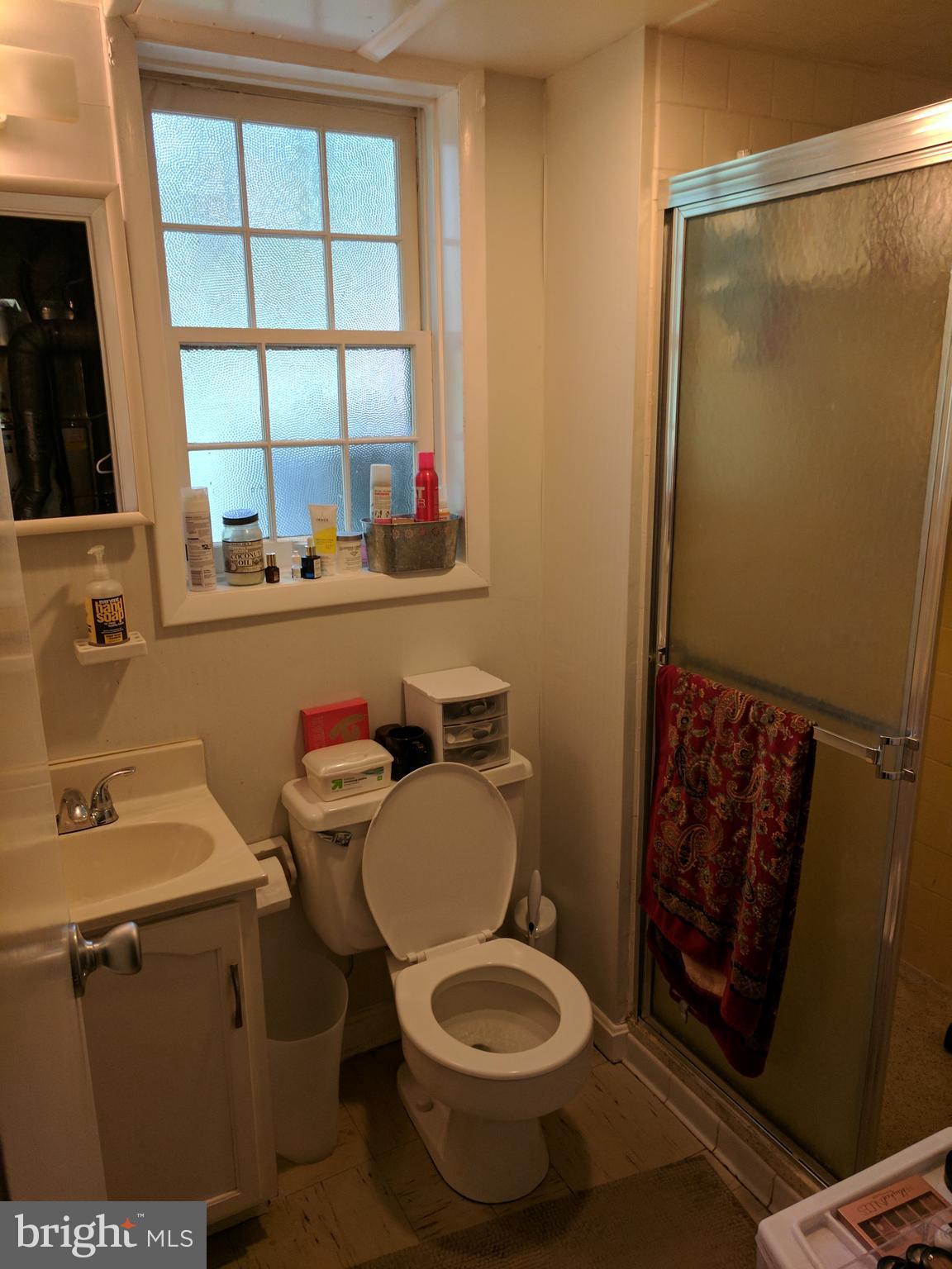 8207 Old Oaks Drive Springfield, VA 22152 - Photo 17 of 21 a bathroom with a toilet sink and mirror