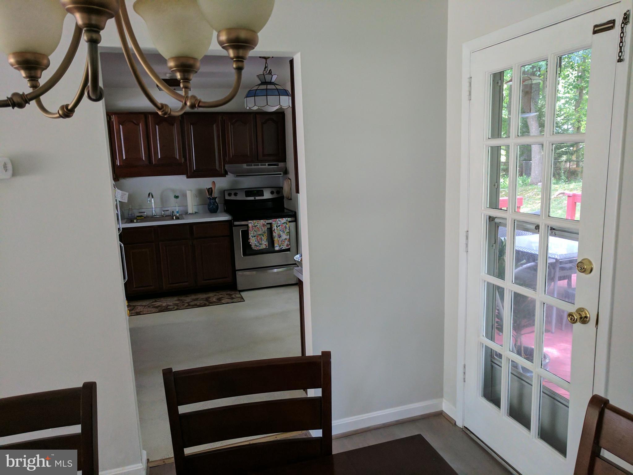 8207 Old Oaks Drive Springfield, VA 22152 - Photo 5 of 21 a view of living room with furniture and flat screen tv