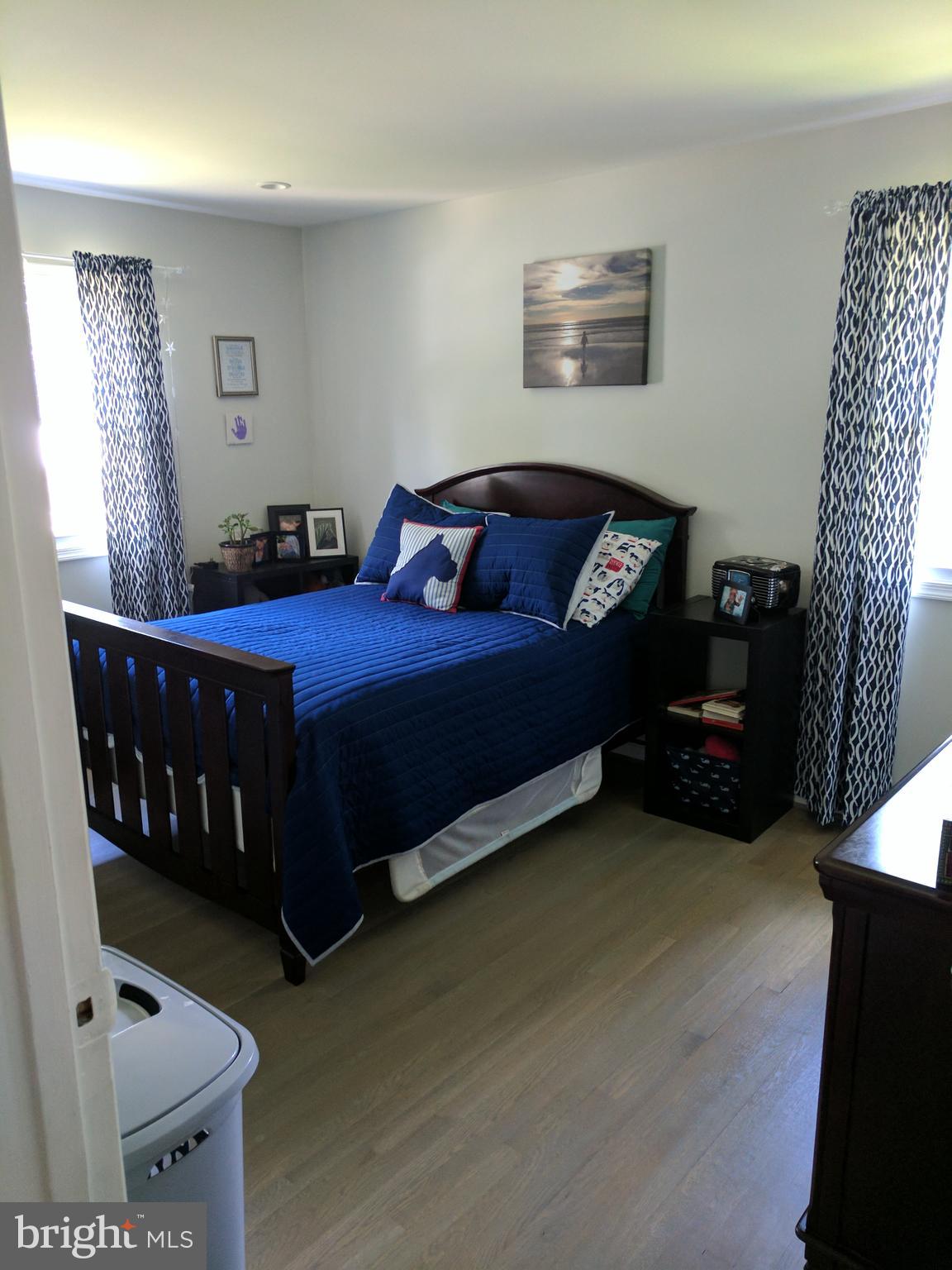 8207 Old Oaks Drive Springfield, VA 22152 - Photo 9 of 21 a bedroom with a bed and a window