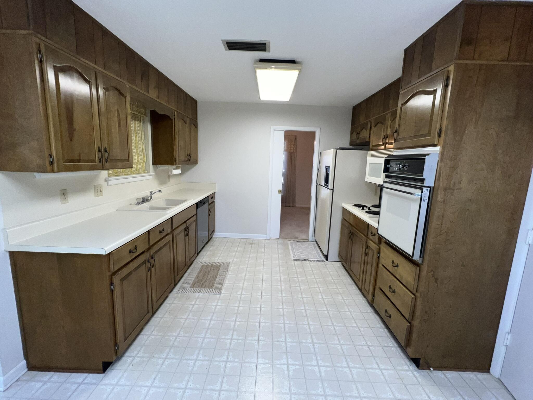 18 Sherwood Road Northwest Fort Walton Beach, FL 32547 - Photo 11 of 49 a kitchen with granite countertop a sink and stainless steel appliances