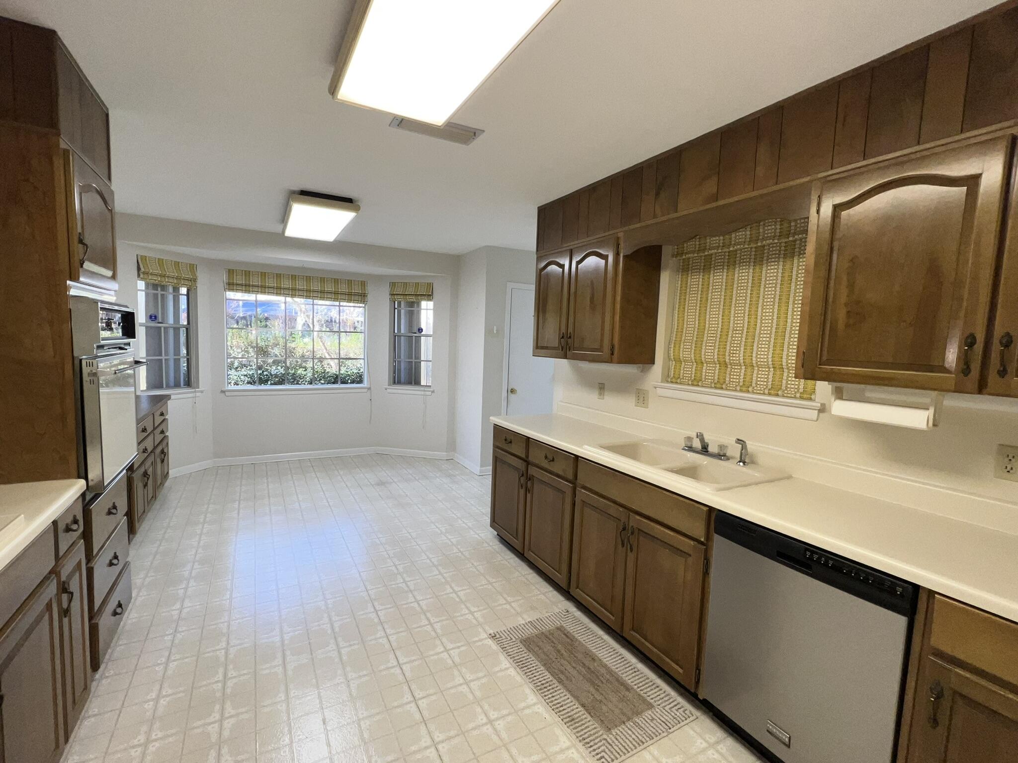 18 Sherwood Road Northwest Fort Walton Beach, FL 32547 - Photo 12 of 49 a large bathroom with a large mirror vanity and sink
