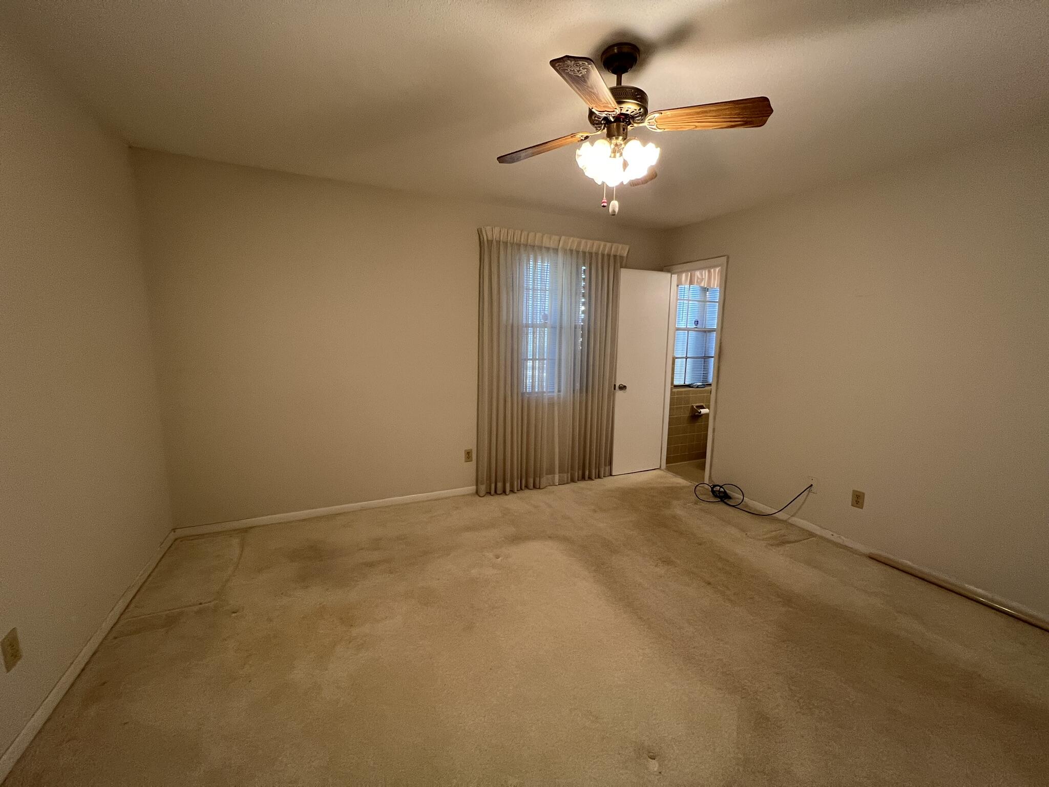 18 Sherwood Road Northwest Fort Walton Beach, FL 32547 - Photo 23 of 49 an empty room with closet and chandelier fan