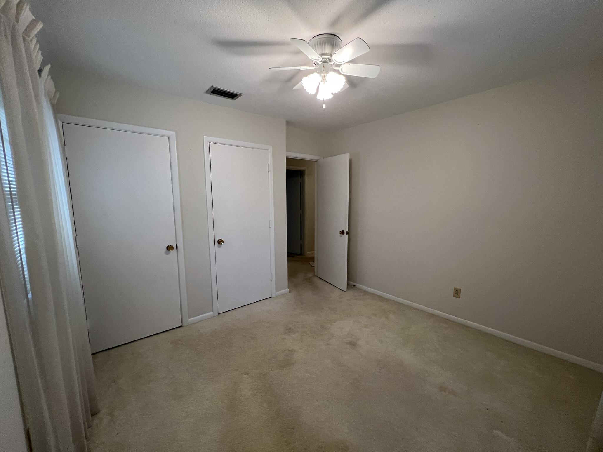 18 Sherwood Road Northwest Fort Walton Beach, FL 32547 - Photo 28 of 49 a view of an empty room with a chandelier fan