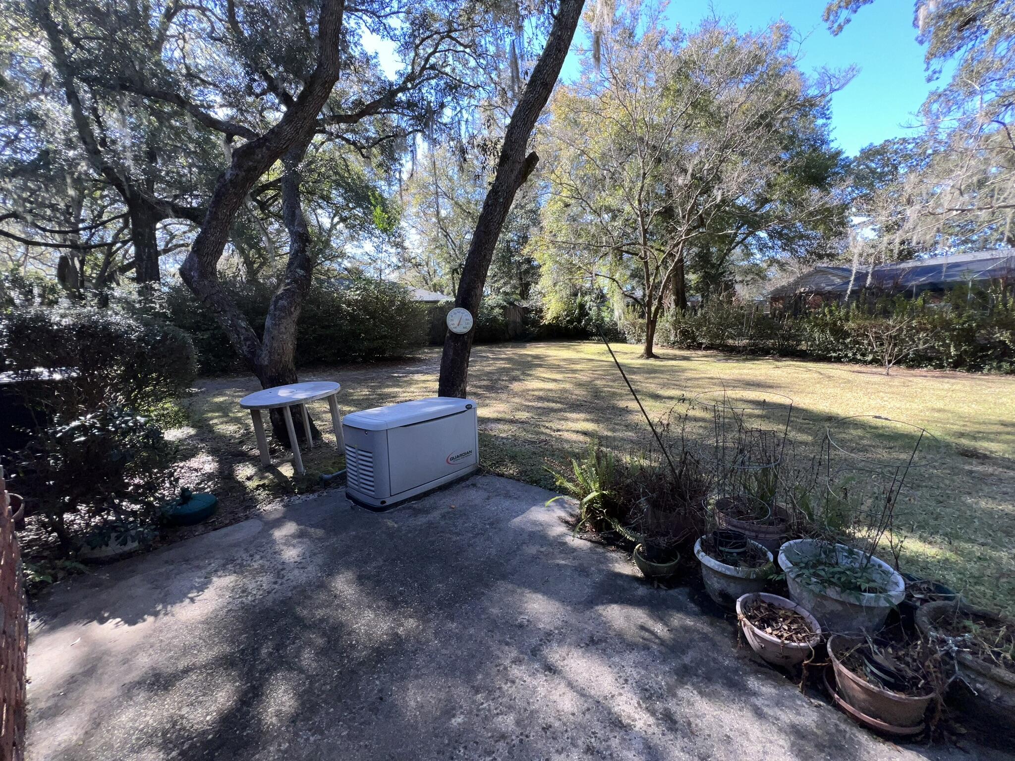 18 Sherwood Road Northwest Fort Walton Beach, FL 32547 - Photo 36 of 49 a view of a backyard with plants and trees