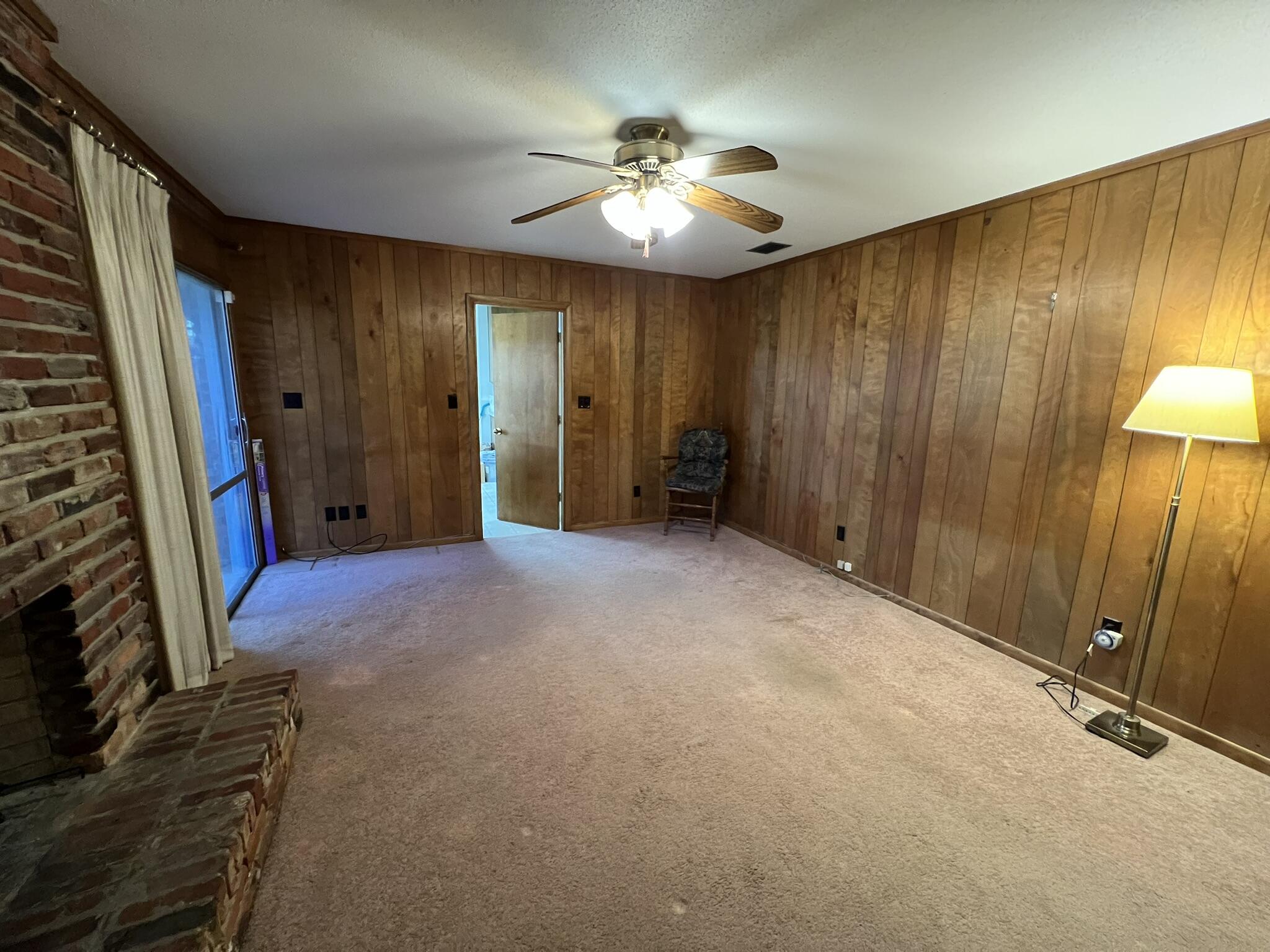 18 Sherwood Road Northwest Fort Walton Beach, FL 32547 - Photo 9 of 49 wooden floor in an empty room with a window