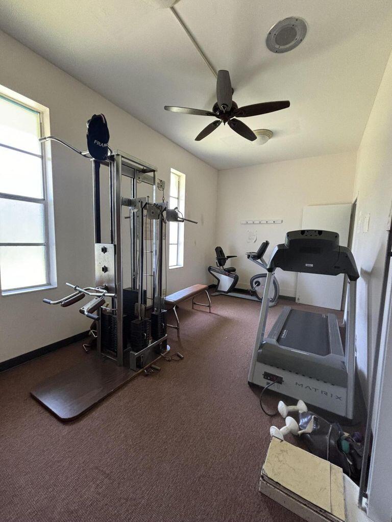 3400 Springdale Boulevard, Unit 217 Palm Springs, FL 33461 - Photo 12 of 15 a room with gym equipment and a window