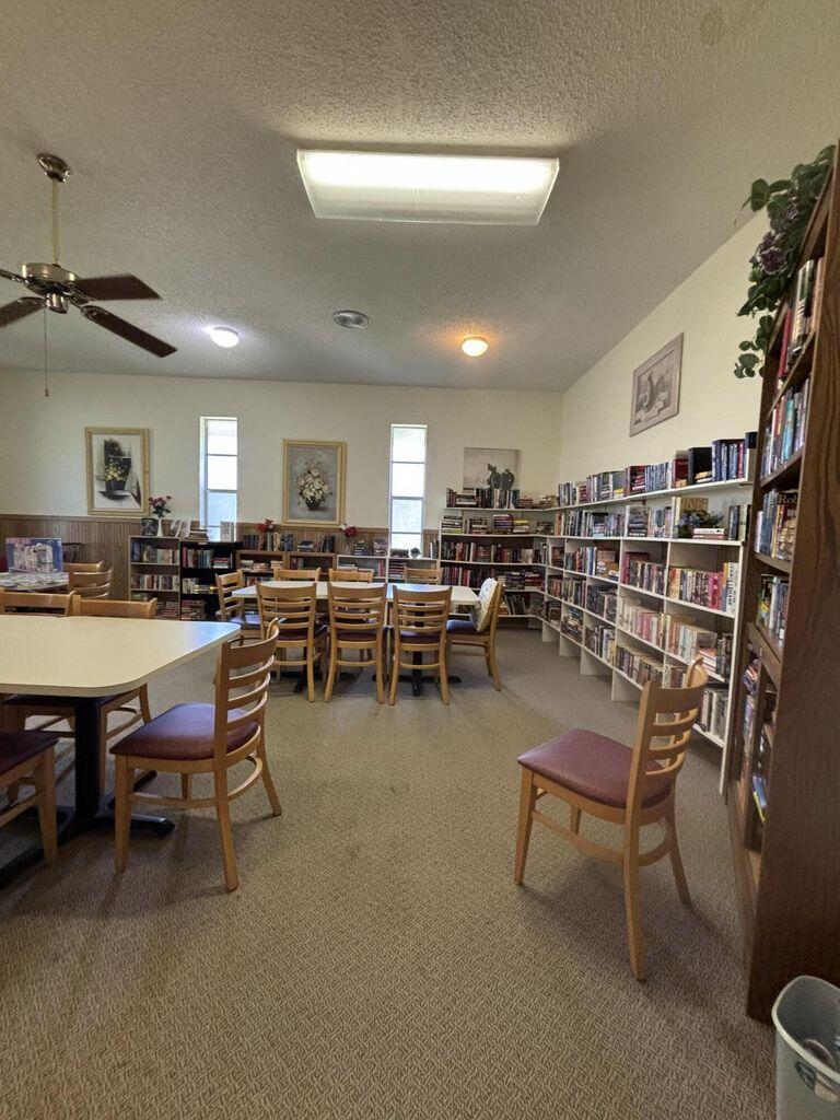 3400 Springdale Boulevard, Unit 217 Palm Springs, FL 33461 - Photo 14 of 15 a room with lots of furniture and lots of furniture