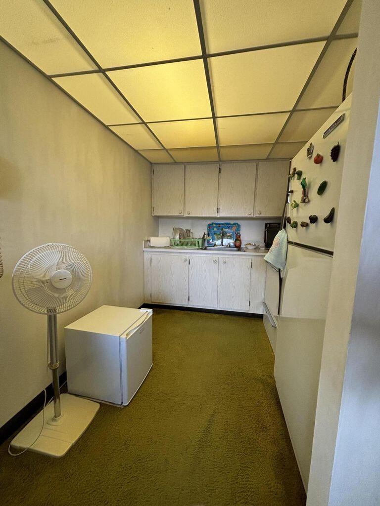 3400 Springdale Boulevard, Unit 217 Palm Springs, FL 33461 - Photo 4 of 15 a bathroom with a sink and mirror