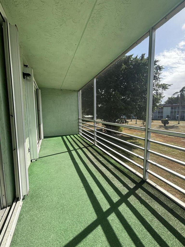 3400 Springdale Boulevard, Unit 217 Palm Springs, FL 33461 - Photo 9 of 15 a view of backyard with green space