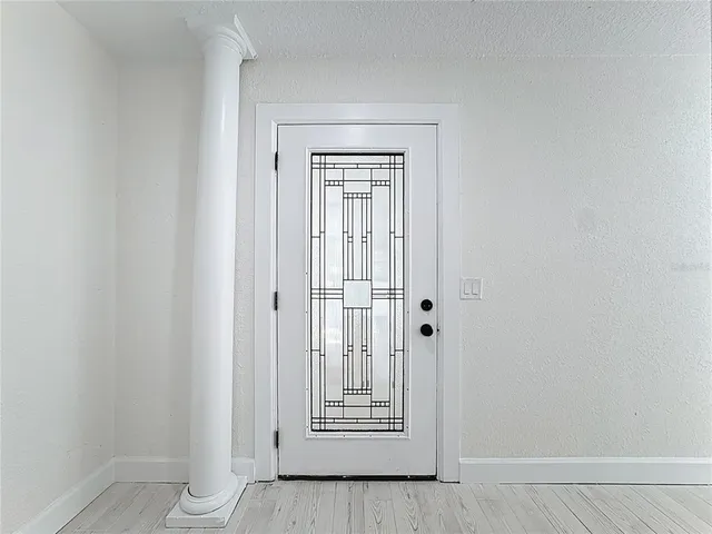 a view of an empty room with a window