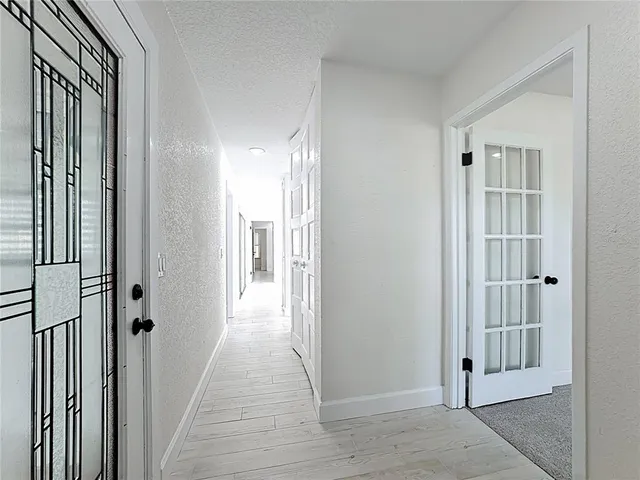 a kitchen with a refrigerator and a sink