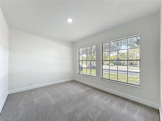 a kitchen with granite countertop a stove top oven a sink dishwasher and a refrigerator with wooden floor