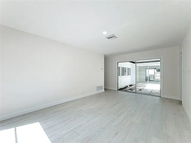 a bathroom with a sink toilet and window