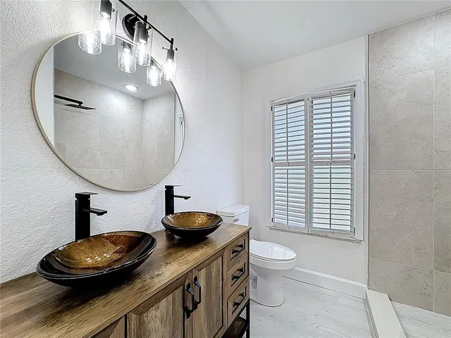 an aerial view of a house with outdoor space