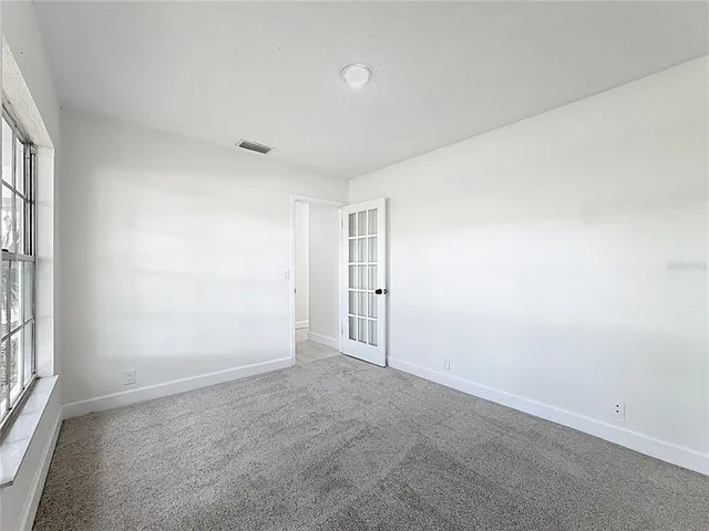 a bathroom with a toilet a sink and a mirror