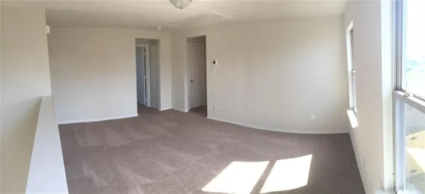 a view of a room that has a window