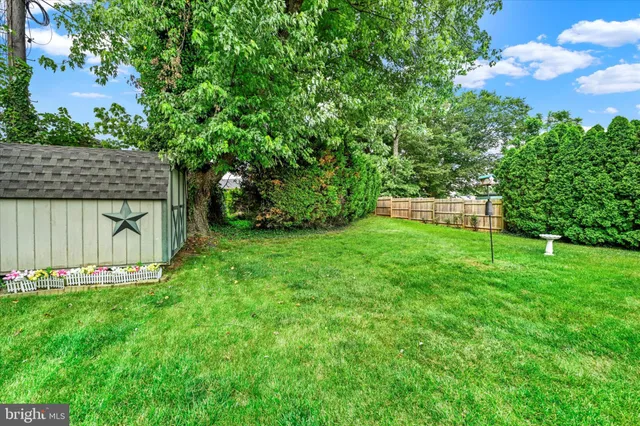 a view of a backyard with a barn