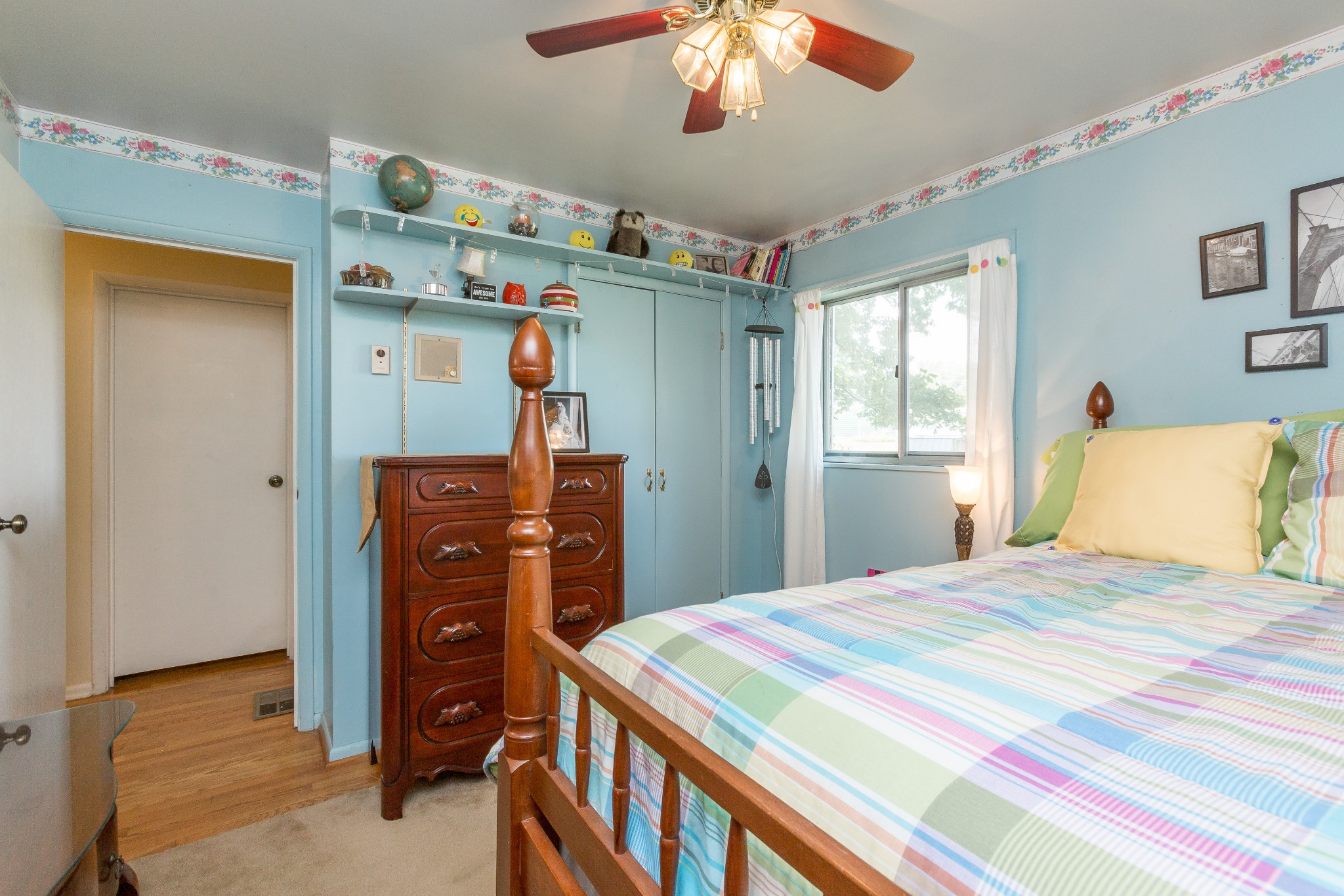 5101 New Chapel Road Springfield, TN 37172 - Photo 27 of 41 a bedroom with a bed and a chandelier