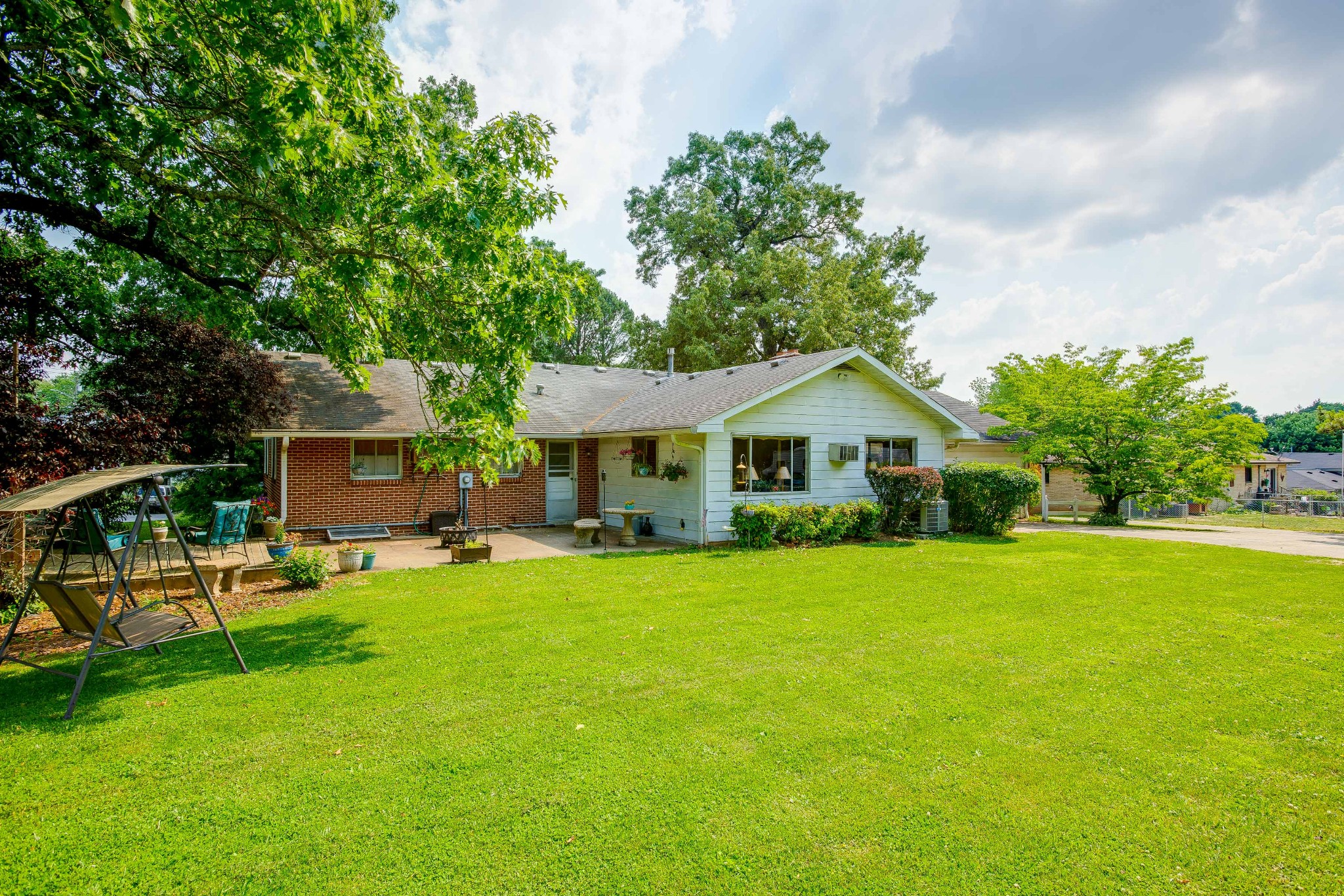 5101 New Chapel Road Springfield, TN 37172 - Photo 38 of 41 a front view of a house with a garden and trees