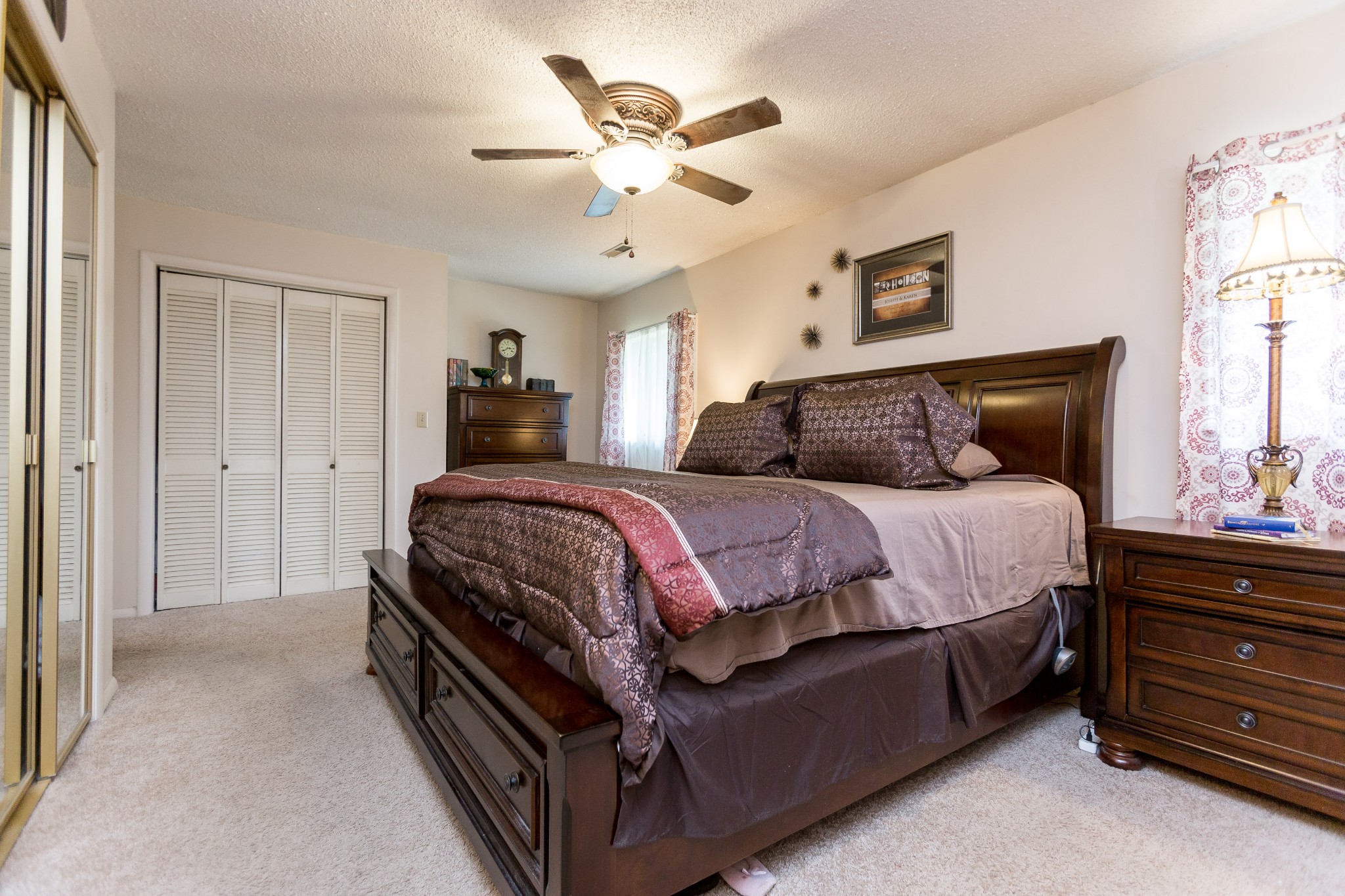 5101 New Chapel Road Springfield, TN 37172 - Photo 9 of 41 a bedroom with a bed and a chandelier