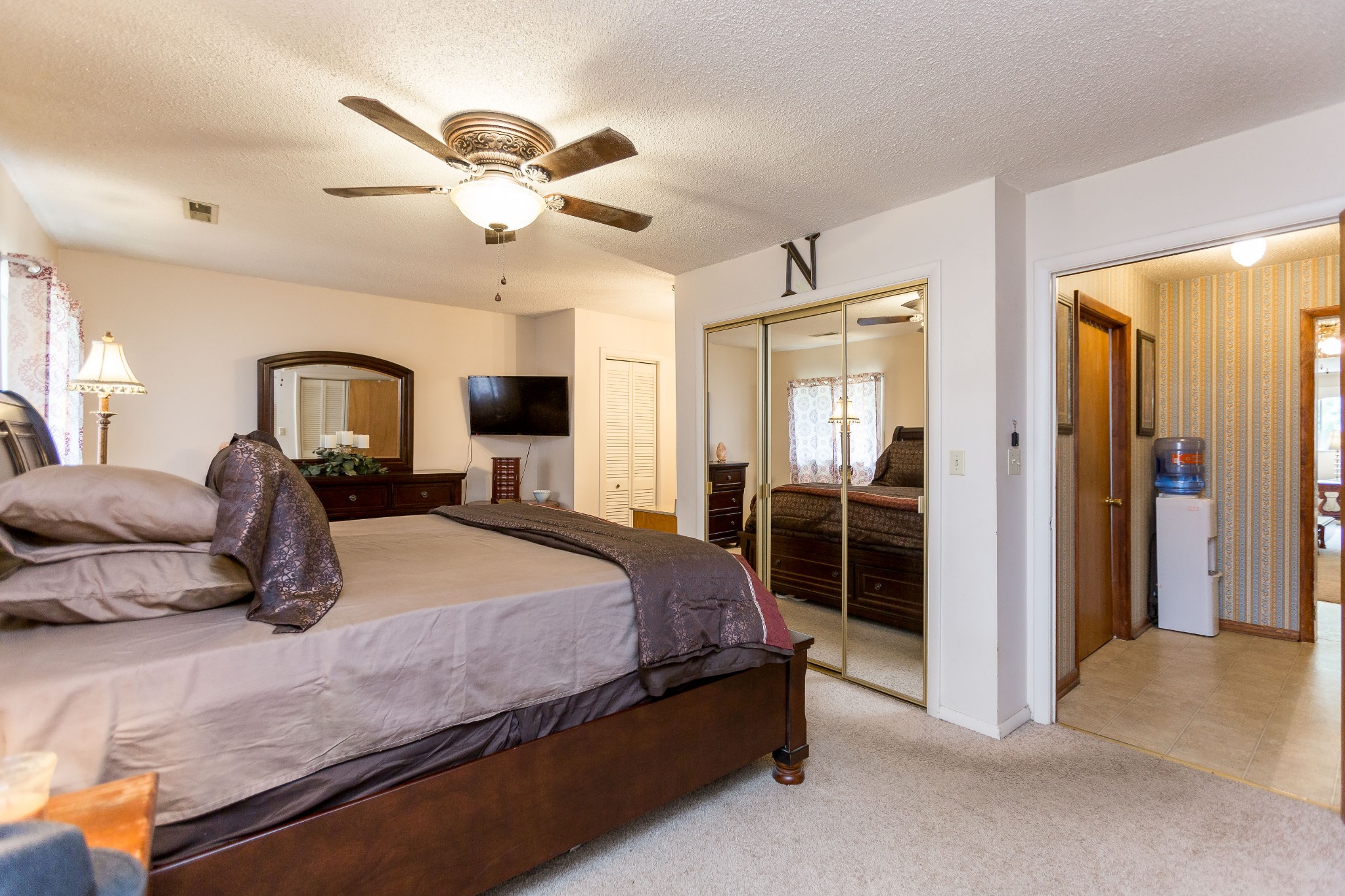 5101 New Chapel Road Springfield, TN 37172 - Photo 10 of 41 a bedroom with a large bed and ceiling fan