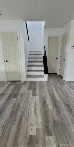 a view of entryway with wooden floor