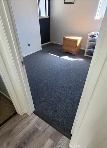 a view of room with wooden floor