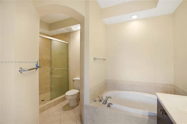 a bathroom with a bathtub and toilet