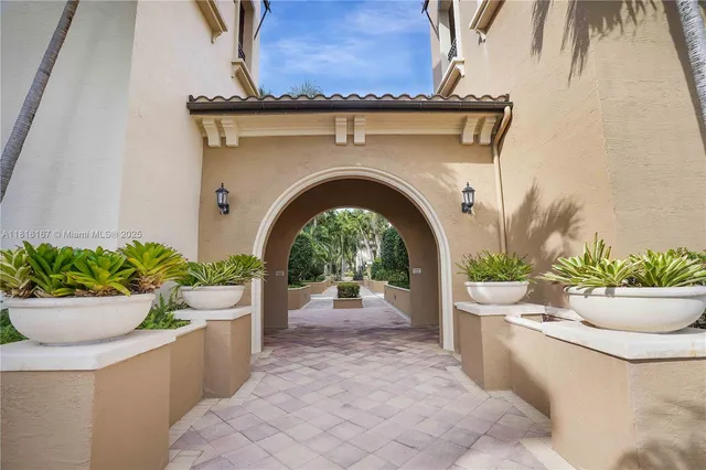 a living room with a potted plant