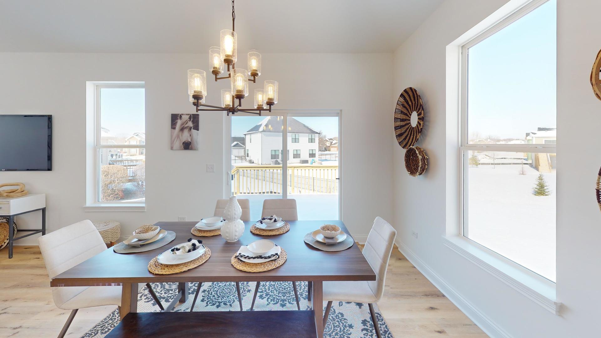 138 Trumpet Vine Circle Elgin, IL 60124 - Photo 11 of 46 a view of a dining room with furniture and chandelier