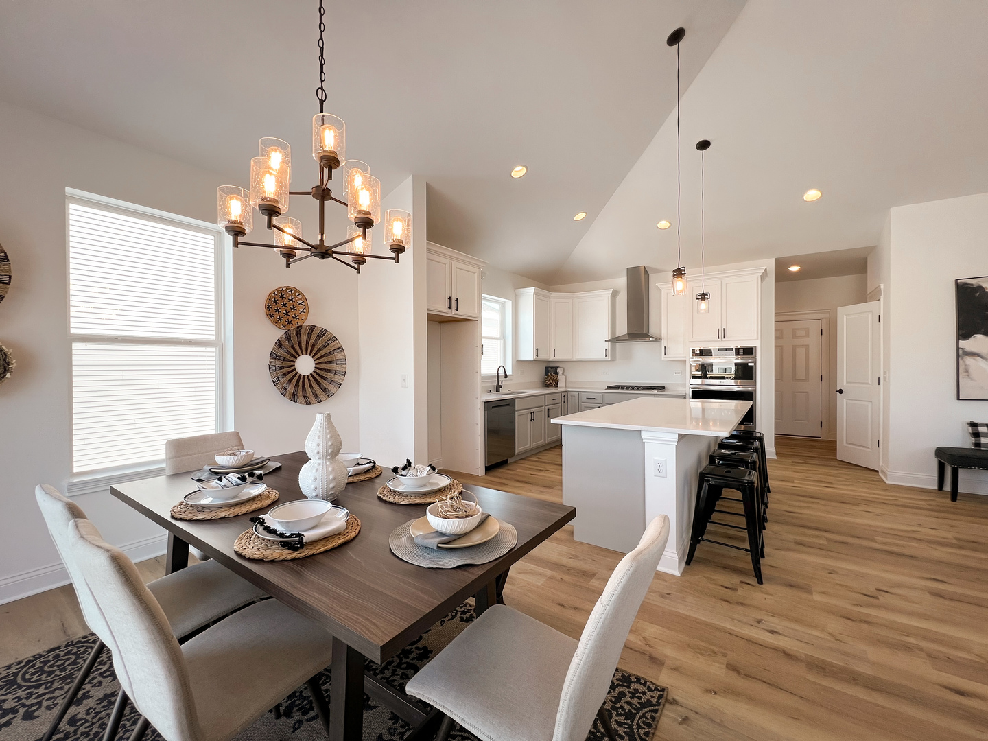 138 Trumpet Vine Circle Elgin, IL 60124 - Photo 13 of 46 a view of a dining room and livingroom with furniture wooden floor kitchen chandelier