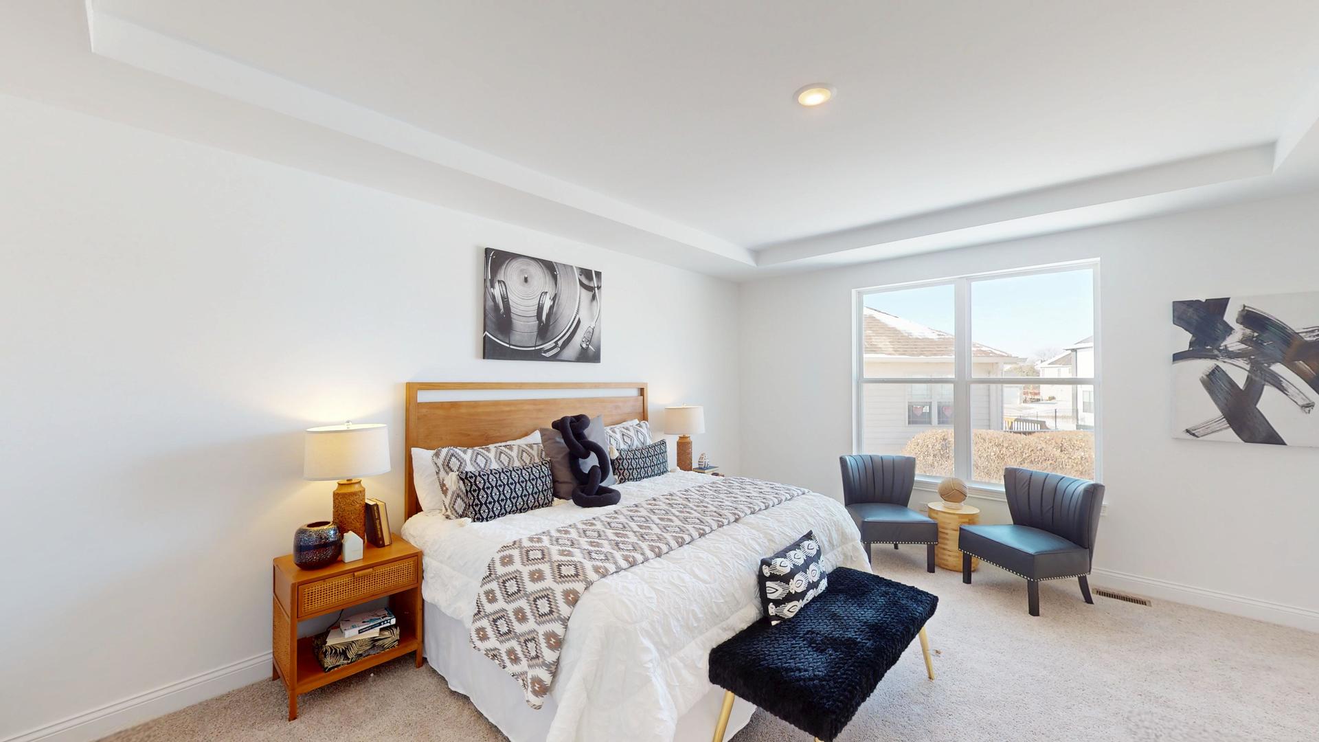 138 Trumpet Vine Circle Elgin, IL 60124 - Photo 28 of 46 a bedroom with a bed and wooden floor