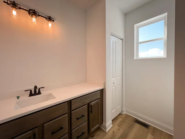 a bathroom with a sink and a mirror