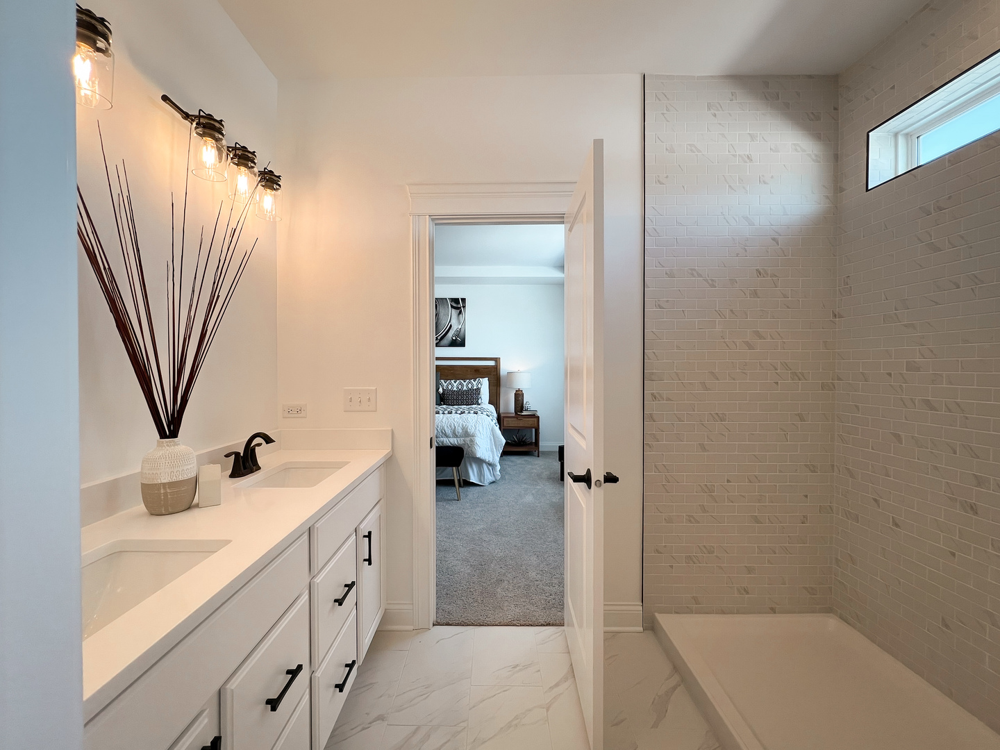 138 Trumpet Vine Circle Elgin, IL 60124 - Photo 45 of 46 a bathroom with a double vanity sink a mirror and a bathtub